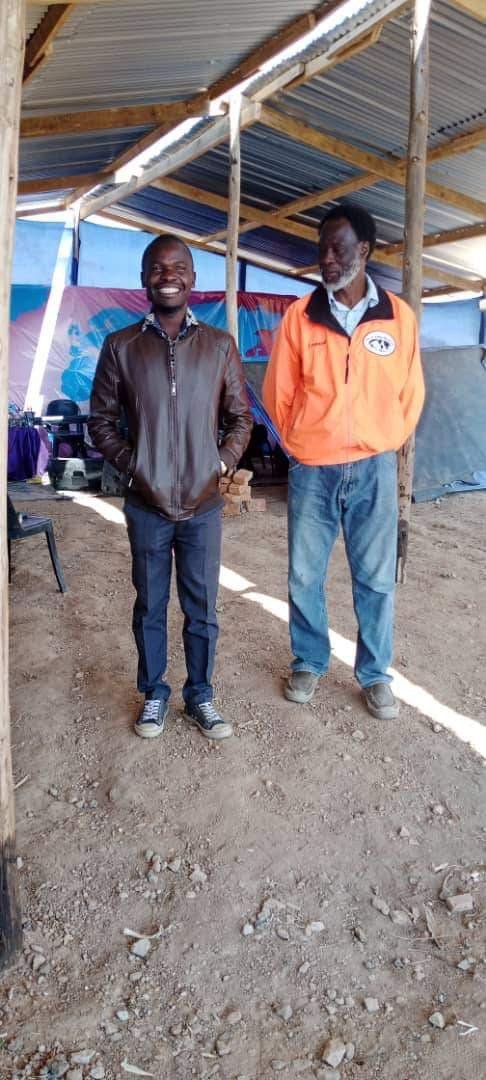 Apostle Warren Nyamatanga with an NFM team member at the Karoi church building site