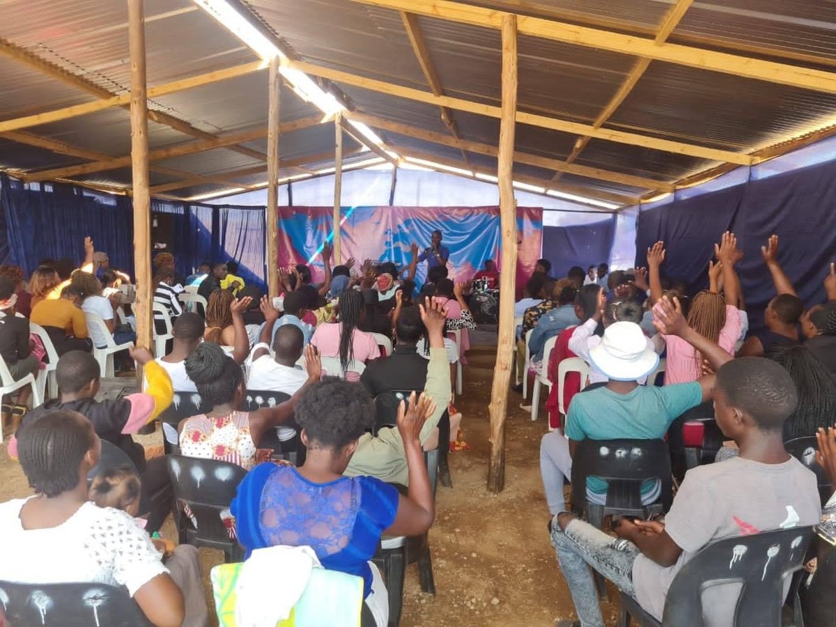 Full congregation standing and seated inside the completed Karoi church